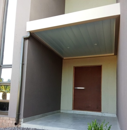 Patio Ceiling with Desert Sand Fascia Gutter - Pebble Rock Estate