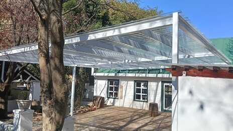 Installed approximately 4 meters high to maintain the spacious feel of the courtyard.